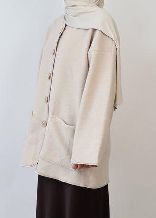 Mantel mit Knöpfen aus Teddyfleece| Beige